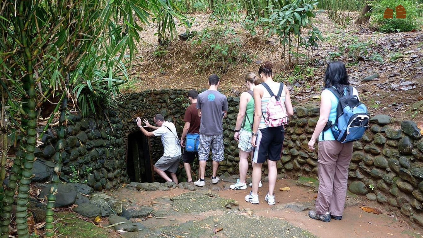 Travelers experience the underground life when visiting Cu Chi Tunnel